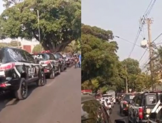 Policiais protestam com máscaras e são retirados de desfile